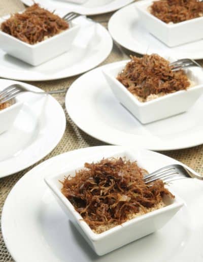 Portions of Arrumadinho, shredded dried beef ('charque'), served in individual bowls